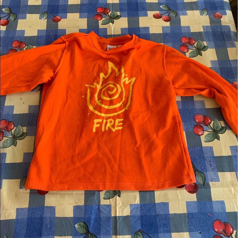 A reddish orange sweater